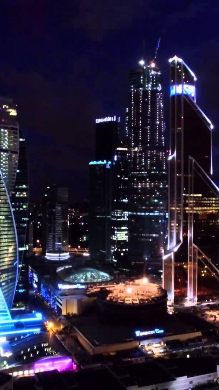 Обои ночь, городской пейзаж, город, городской район, метрополия в разрешении 720x1280