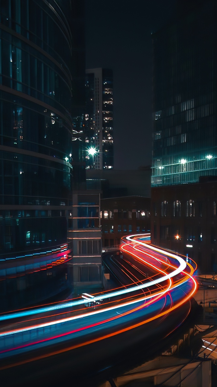 Обои городской пейзаж, здание, небоскреб, автомобильное освещение, электричество в разрешении 720x1280