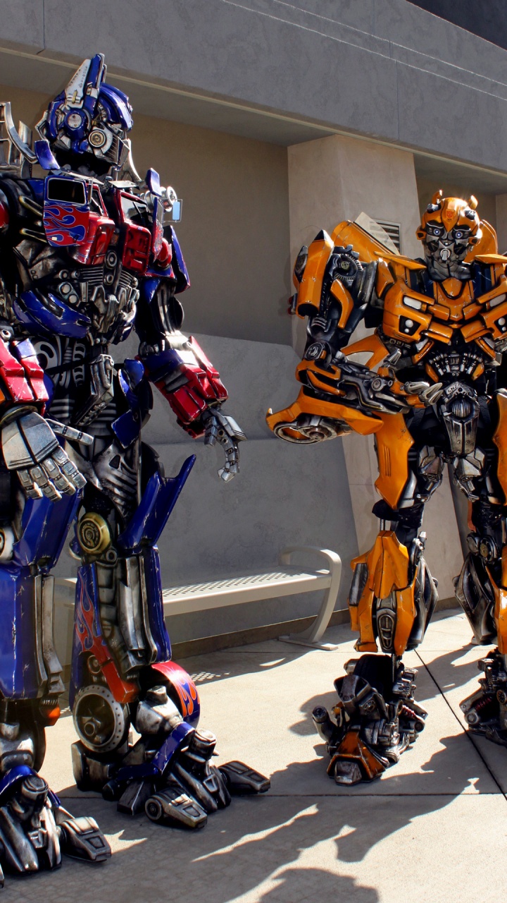 Обои в трансформаторах, Трансформаторы прогулка 3D, Оптимус Прайм, универсальные студии Голливуда, Мегатрон в разрешении 720x1280