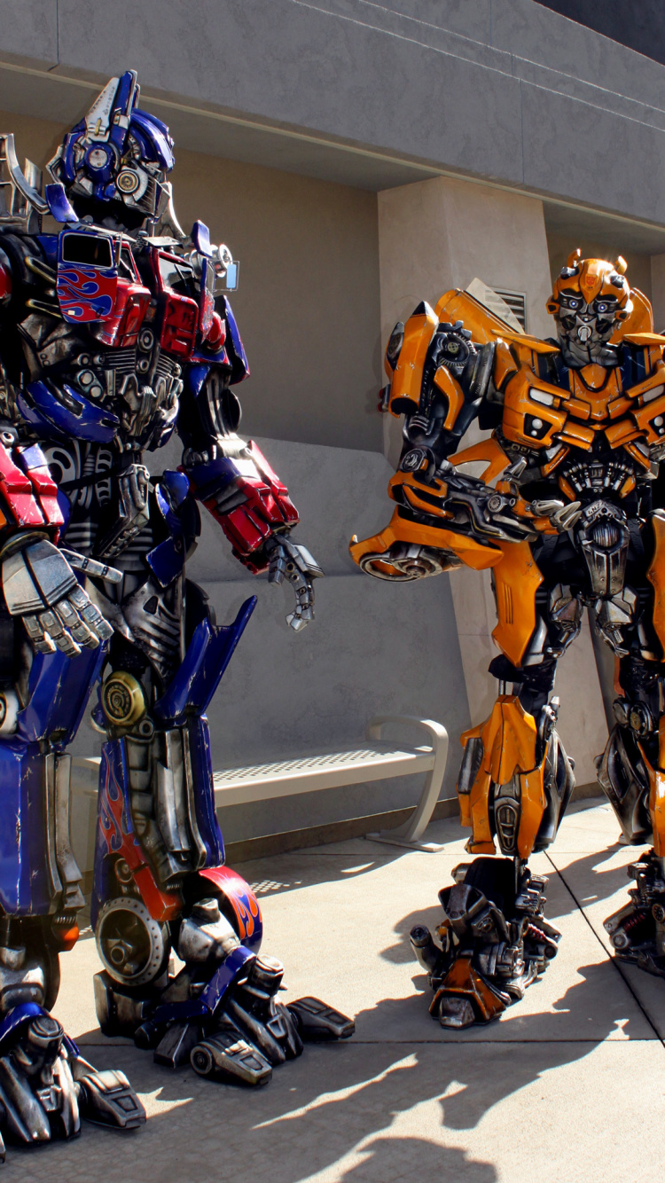 Обои в трансформаторах, Трансформаторы прогулка 3D, Оптимус Прайм, универсальные студии Голливуда, Мегатрон в разрешении 750x1334