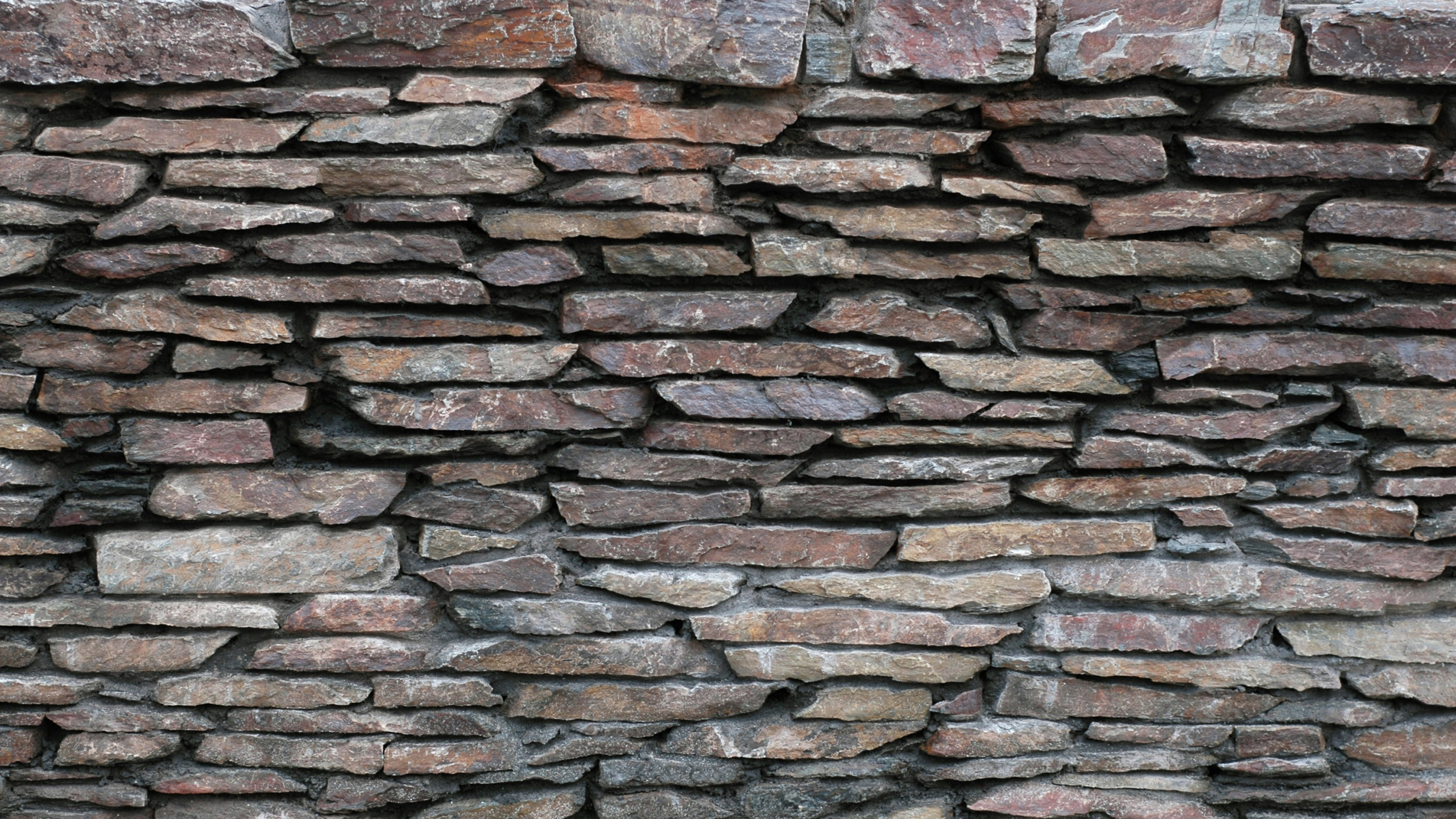 Обои кирпичная кладка, каменная стена, кирпич, стена, каменщик в разрешении 2560x1440