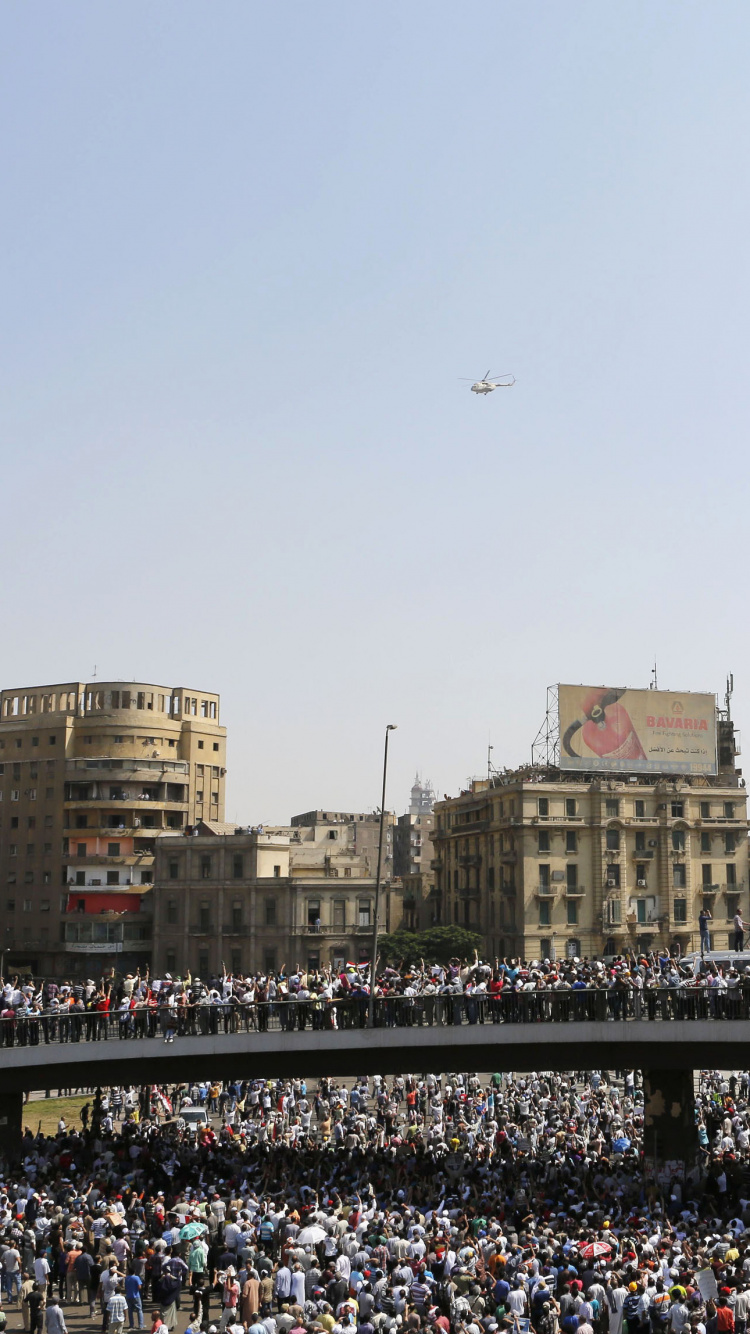 Обои ориентир, мусульманские братья, толпа, город, здание в разрешении 750x1334