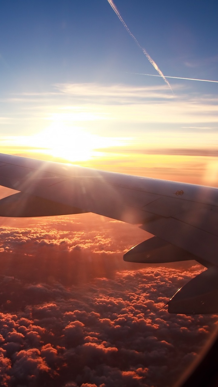 Обои самолет, самолеты, полет, закат, воздушное путешествие в разрешении 720x1280