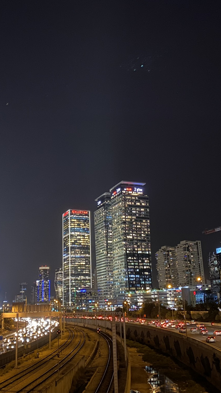 Обои ночь, дорога, башня, инфраструктура, город в разрешении 750x1334