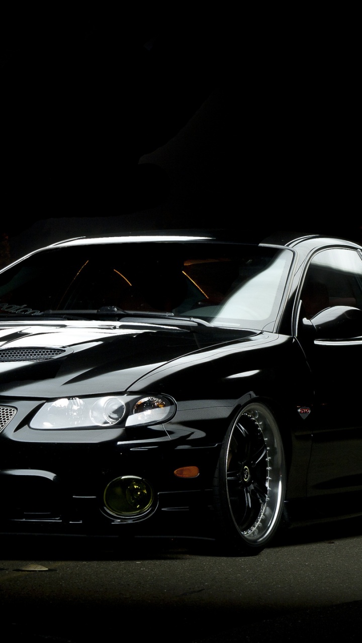 Обои фара, спорткар, Понтиак, авто, автомобильное освещение в разрешении 720x1280