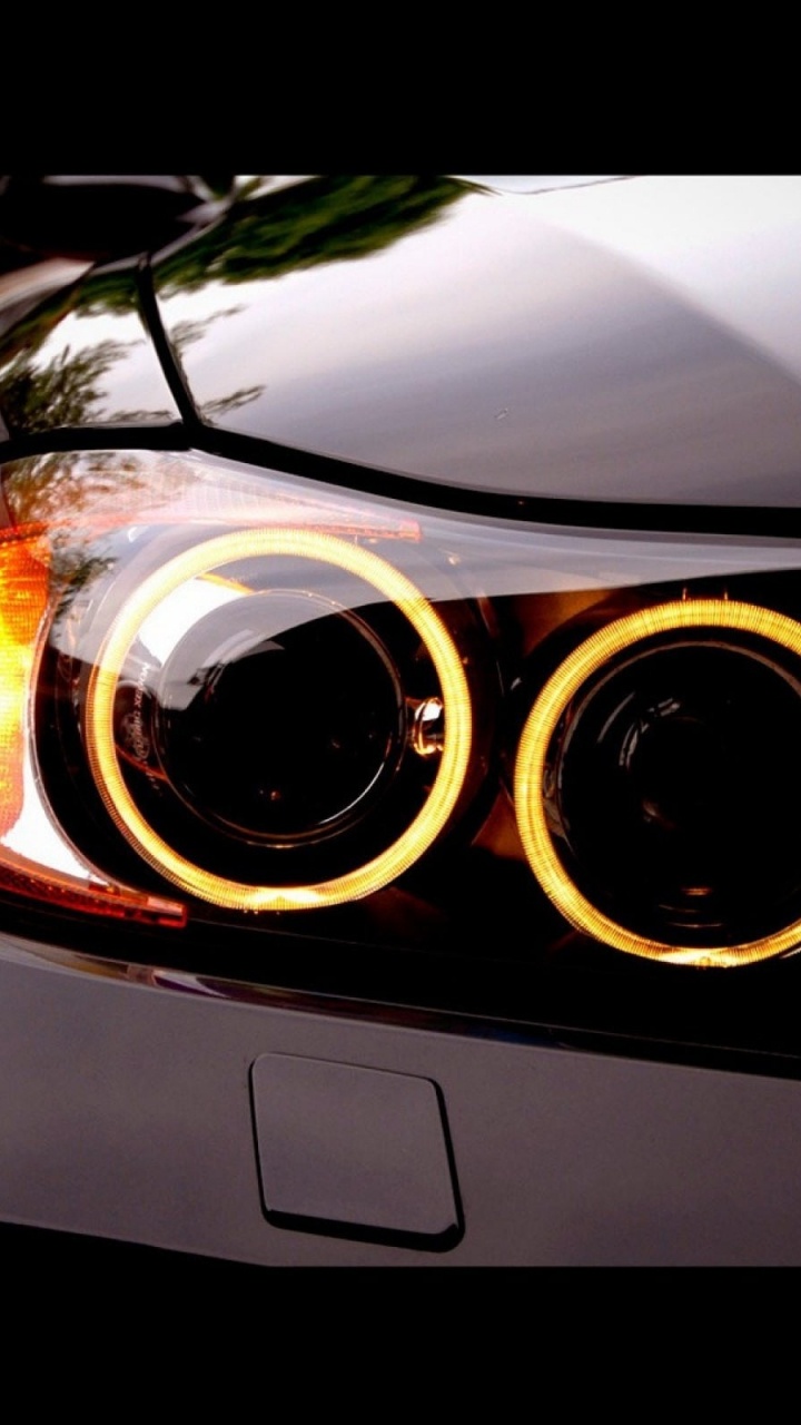 Обои авто, фара, автомобильное освещение, свет, автомобильные запчасти в разрешении 720x1280