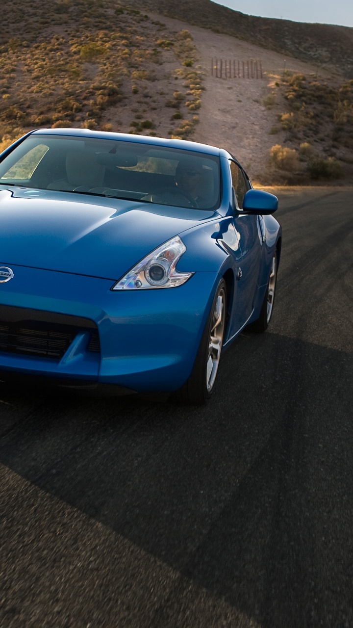 Обои Ниссан 370z вышли синий, Ниссан, авто, 2012 Ниссан 370z вышли, спорткар в разрешении 720x1280