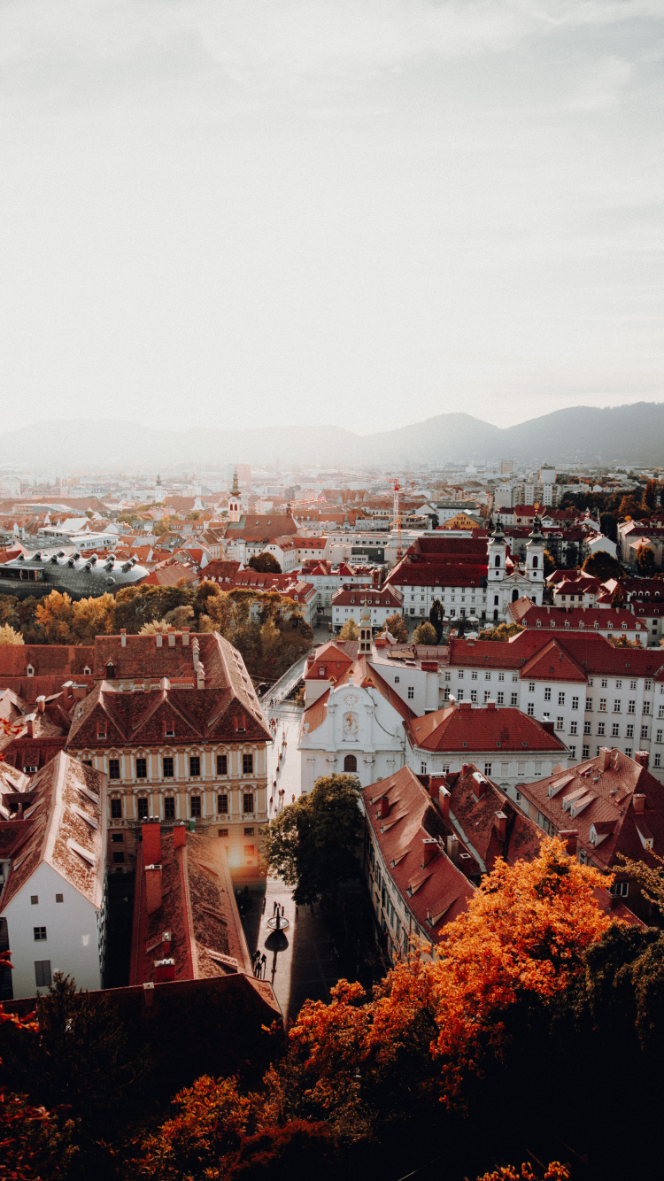 Обои небо, городок, город, крыша, свет в разрешении 750x1334