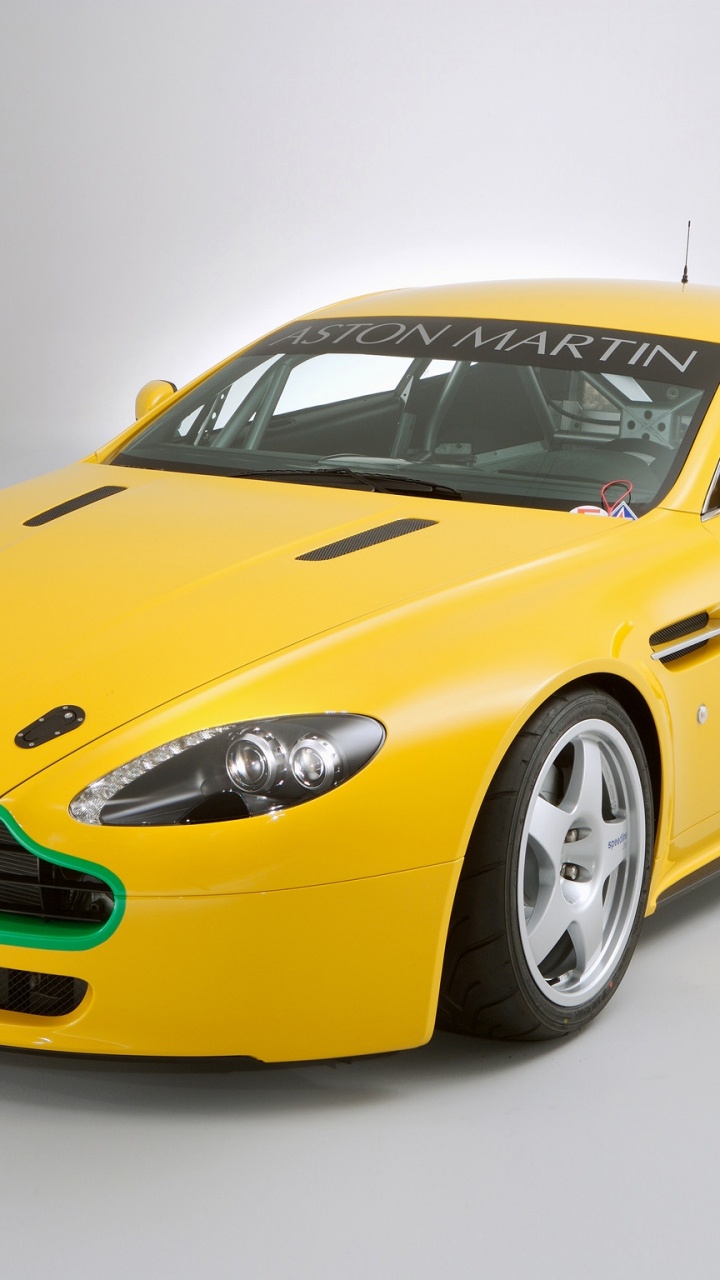 Обои Астон Мартин db9, спорткар, желтый, автомобиль, Астон Мартин вираж в разрешении 720x1280