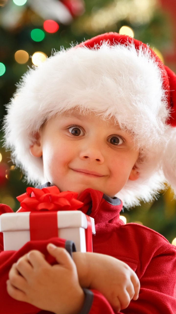 Обои подарок, праздник, Рождество, Санта-Клаус, красный цвет в разрешении 720x1280